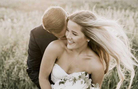 Bride and groom smiling